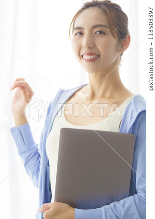 Portrait of a young woman who started an online yoga salon 118503397