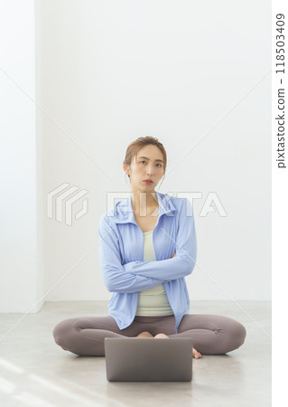 Portrait of a young woman who started an online yoga salon 118503409