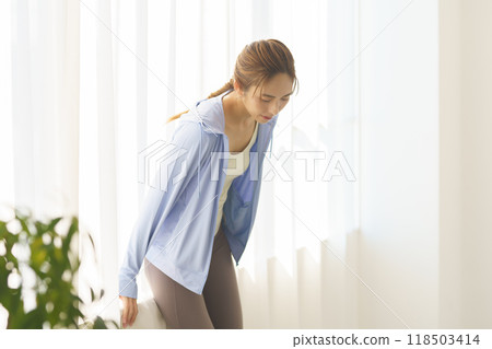 Portrait of a young woman who started an online yoga salon 118503414