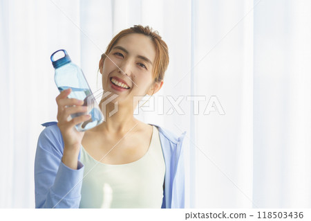 Portrait of a young woman who started an online yoga salon 118503436