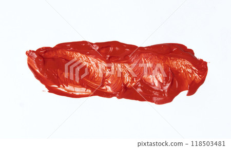 A red paint smear on a white background. High quality photo 118503481