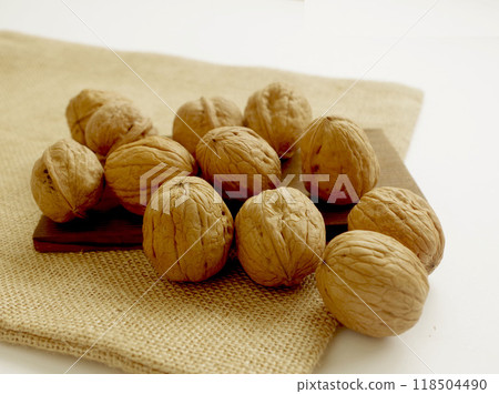 Walnuts, nuts, linen cloth, white background 118504490