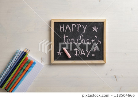Top view of small black board with a Happy teachers day sign on it Top view of small black board with a Happy teachers day sign on it 118504666