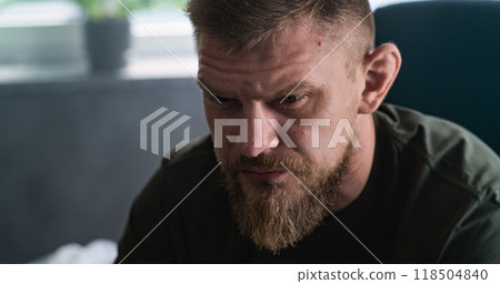 Close up of military man with contusion or PTSD crying during rehabilitation after war Close up of military man with contusion or PTSD crying during rehabilitation after war 118504840