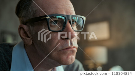 Close up of senior psychotherapist in glasses communicating and listening to patient 118504854