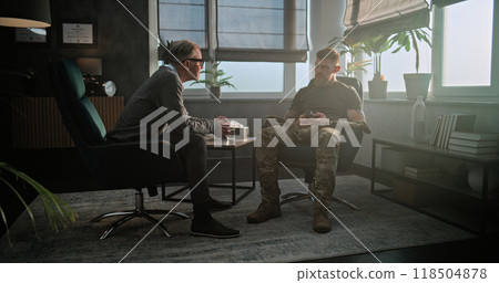 Senior psychiatrist gives antidepressants or sedative medicines to military man with PTSD 118504878