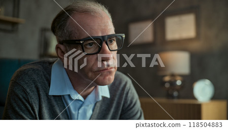 Portrait of senior military psychologist listening to patient, asking questions 118504883