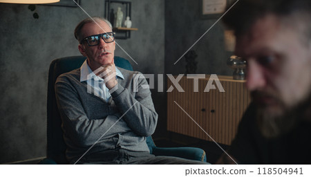 Senior therapist conducts psychotherapy session to soldier with PTSD 118504941