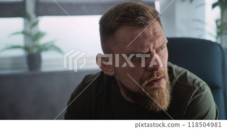 Close up of military man with PTSD crying, talking to psychotherapist Close up of military man with PTSD crying, talking to psychotherapist 118504981