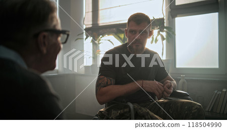 Military man with physical disability shakes hands with psychotherapist Military man with physical disability shakes hands with psychotherapist 118504990