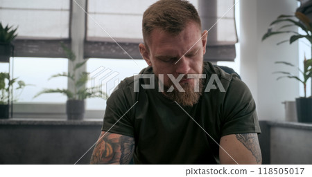 Shocked soldier with contusion or PTSD crying during psychological rehabilitation 118505017