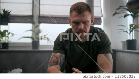 Shocked soldier with contusion or PTSD crying during psychological rehabilitation 118505022