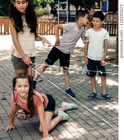 Children games. Boyl goes through the tangled rope 118505023