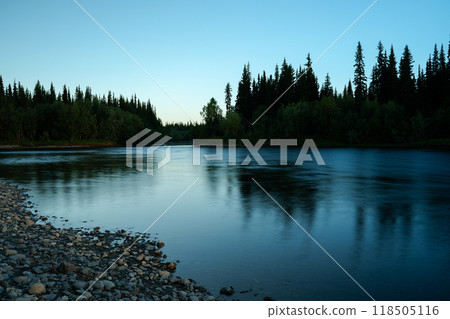 Frozen river near black night forest 118505116