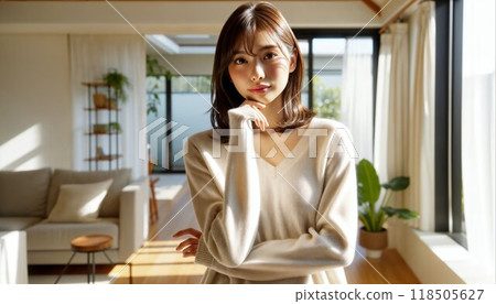 A worried woman looking straight ahead with her hands on her face 118505627