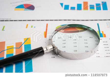 Magnifying glass on spreadsheet and graph paper. Financial development, Banking Account, Statistic, Investment Analytic research data economy, Business. 118507873