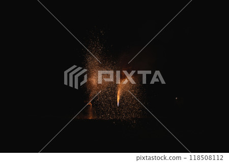 Akihayama Hongu Akiha Shrine: Orange flames of hand-held fireworks exploding in the darkness at the dedication fireworks festival (Shizuoka Prefecture) 118508112