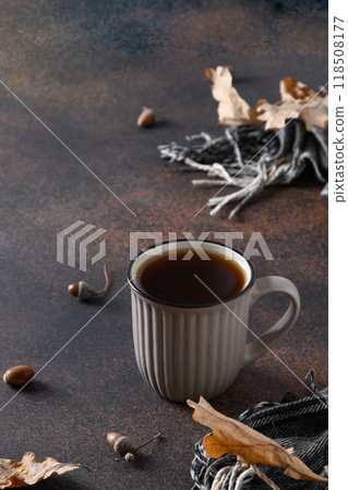 Acorn coffee in cup on brown. Alternative coffee substitute without caffeine. Close up. Vertical format. Acorn coffee in cup on brown. Alternative coffee substitute without caffeine. Close up. Vertical format. 118508177