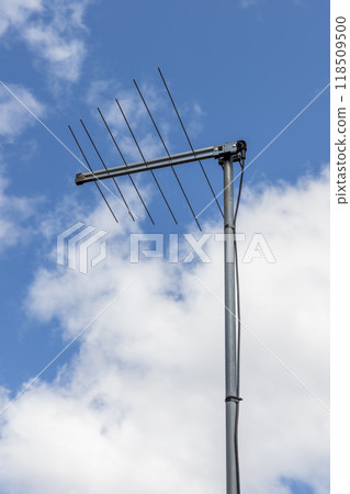 A television antenna on a residential house A television antenna on a residential house 118509500