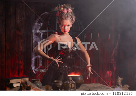 Witch preparing love potion using magic spell in Witch preparing love potion using magic spell in 118512155