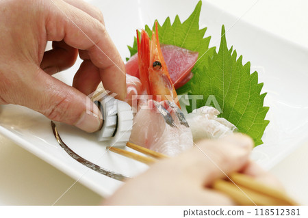 Serving sashimi 118512381