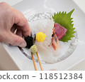 Serving sashimi 118512384