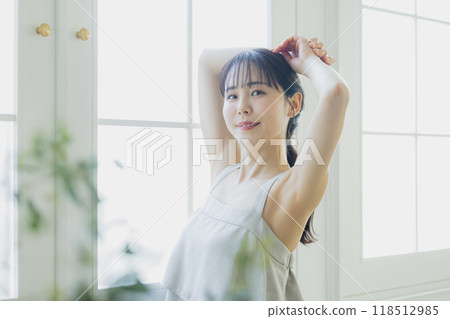 A woman by the window A woman by the window 118512985
