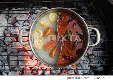 Traditional chinese hot pot with steamed vegetables on the flaming grill 118513202