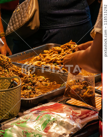 Street Food Vendor Selling Stir-Fried Dishes in Thailand Street Food Vendor Selling Stir-Fried Dishes in Thailand 118513292