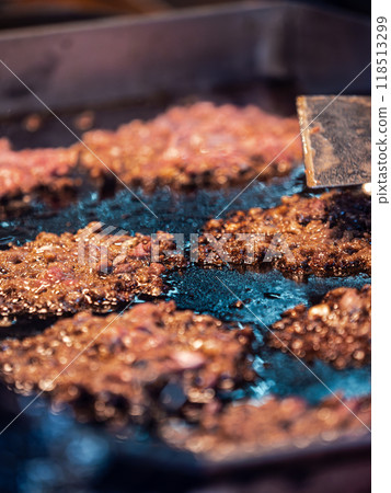 Grilling Burgers on a Flat Top Grill Grilling Burgers on a Flat Top Grill 118513299