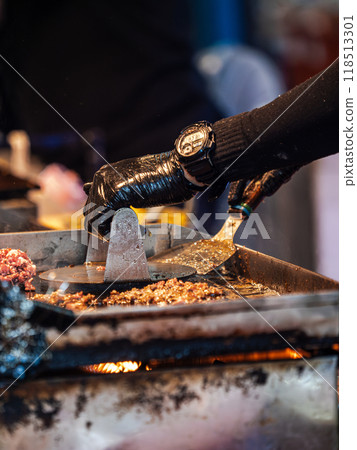 Chef Cooking Food on a Flat-Top Grill Chef Cooking Food on a Flat-Top Grill 118513301