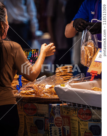 Woman Buying Snacks at a Street Market Woman Buying Snacks at a Street Market 118513309