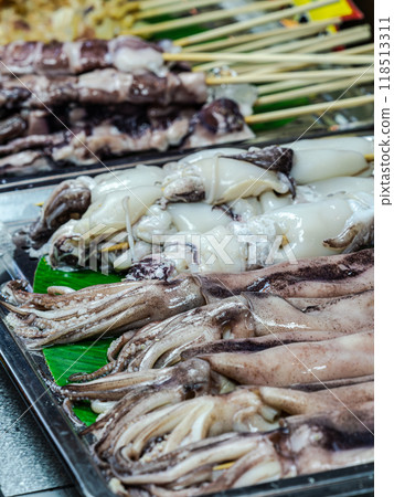 Fresh Squid Skewers at a Market Stall Fresh Squid Skewers at a Market Stall 118513311