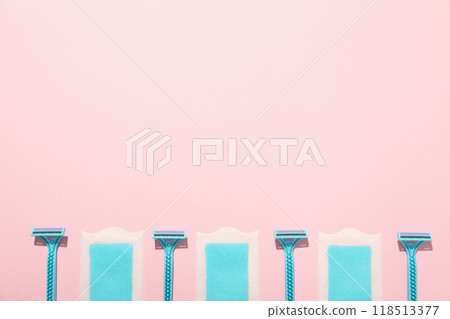 Razors for shaving with hair removal strips on a pink background Razors for shaving with hair removal strips on a pink background 118513377
