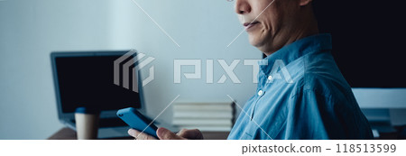 A man troubled in front of a personal computer A man troubled in front of a personal computer 118513599