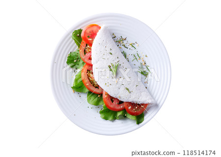 tapioca or beiju with vegetables, tomato, arugula, in white plate isolated on white background tapioca or beiju with vegetables, tomato, arugula, in white plate isolated on white background 118514174