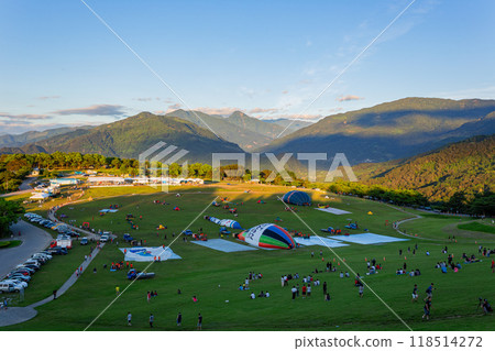 Sunrise landscape with people preparing for the hot air balloon festival at the Luye Highlands 118514272
