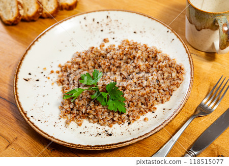 Buckwheat porridge served on plate 118515077