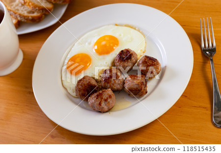 Smoked Spanish albondigas, meatballs cooked with scrambled eggs 118515435