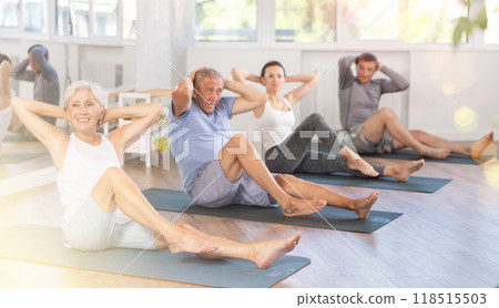 Seniors in sportswear doing exercises at pilates workout Seniors in sportswear doing exercises at pilates workout 118515503