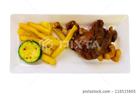 French cuisine, fried duck confit with fried potatoes and eggplant on a plate in restaurant 118515605