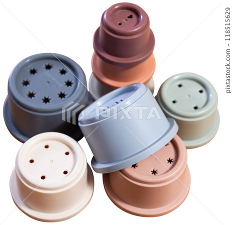 Childrens toy plastic cup pyramid made of multicolored elements Childrens toy plastic cup pyramid made of multicolored elements 118515629