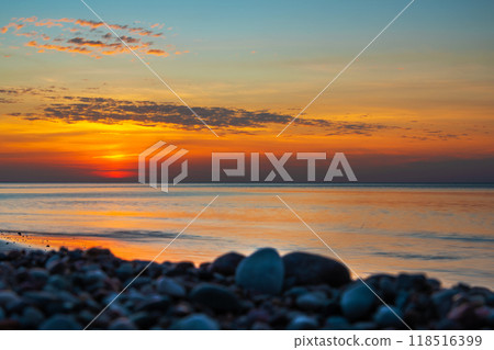 Sandy beach with pebbles of Baltic Sea on Curonian Spit at sunset. Kaliningrad region. Russia 118516399
