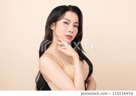 Beautiful young asian woman with clean fresh skin on beige background, Face care, Facial treatment, Cosmetology, beauty and spa, Asian women portrait. 118516459