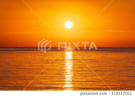 Beautiful red and orange sunrise over the sea. Beautiful red and orange sunrise over the sea. 118517001