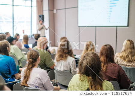 Audience engaging in a professional presentation with speaker at conference Audience engaging in a professional presentation with speaker at conference 118517654