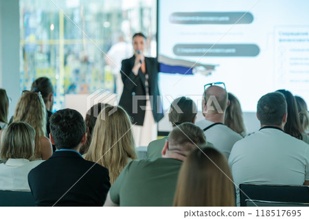 Business conference with speaker presenting to audience 118517695