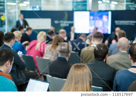 Business professionals attending a conference seminar in a large room Business professionals attending a conference seminar in a large room 118517697