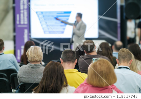 Speaker presenting to attentive audience at business conference Speaker presenting to attentive audience at business conference 118517745