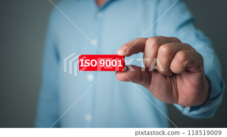 ISO 9001 Standard certification standardisation quality control concept, Businessman showing the ISO 9001 icons for certified and quality management of organizations. ISO 9001 Standard certification standardisation quality control concept, Businessman showing the ISO 9001 icons for certified and quality management of organizations. 118519009